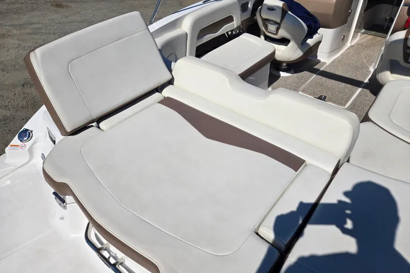 Slide: The Image of 2014 Chaparral 246 SSi boat interior with beige and brown seating. - 48