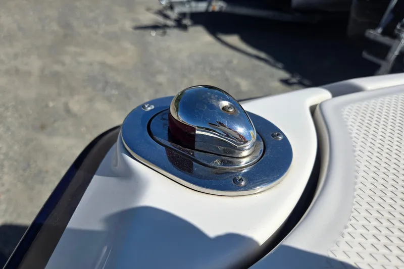 Slide: The Image of Chrome boat cleat on 2014 Chaparral 246 SSi deck, reflecting sunlight. - 51