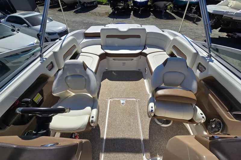 Slide: The Image of Interior view of 2014 Chaparral 246 SSi boat with seating and steering wheel. - 58