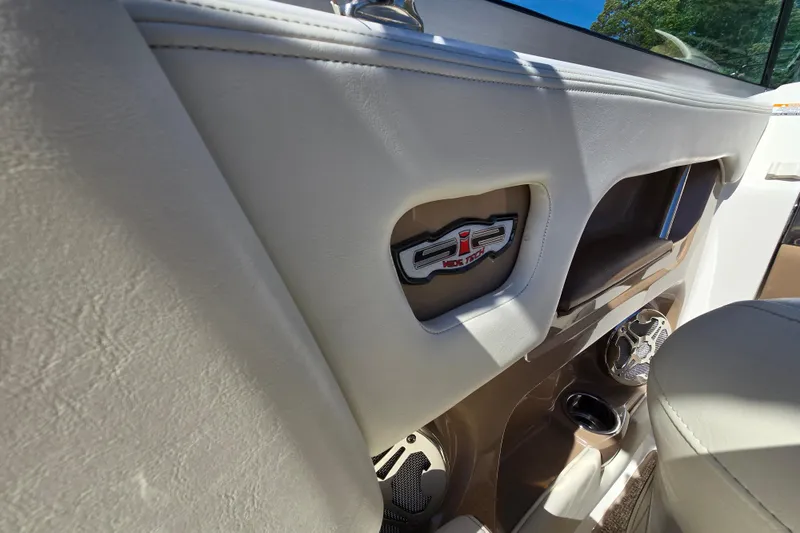 Slide: The Image of Interior of 2014 Chaparral 246 SSi boat with speaker and storage compartment. - 59