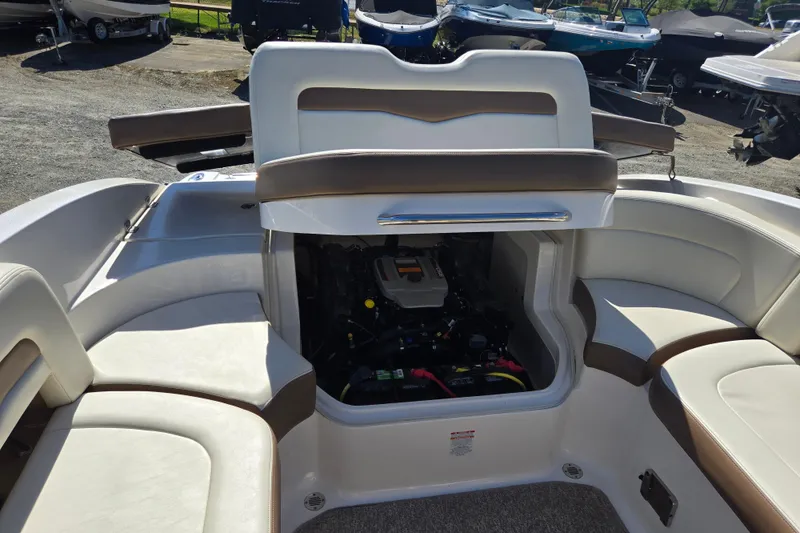 Slide: The Image of 2014 Chaparral 246 SSi boat interior with open engine compartment. - 68
