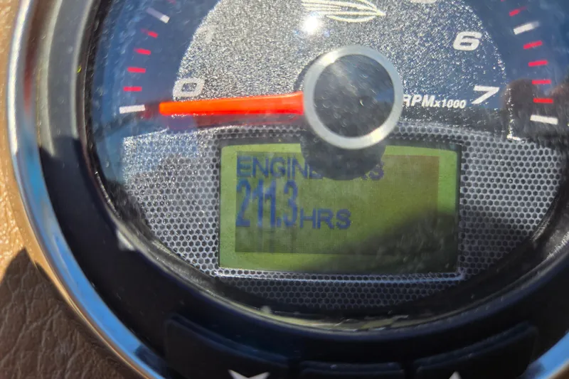 Slide: The Image of Close-up of a 2014 Chaparral 246 SSi tachometer showing 211.3 engine hours. - 70