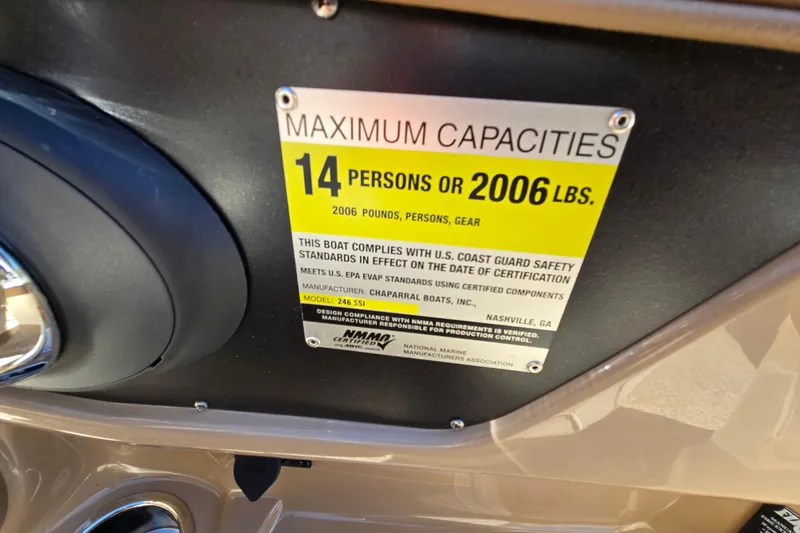 Slide: The Image of Capacity label on 2014 Chaparral 246 SSi boat, max 14 people or 2006 lbs. - 71