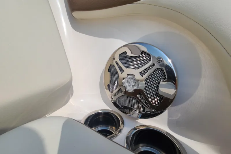 Slide: The Image of Speaker and cup holders on 2014 Chaparral 246 SSi boat interior. - 72
