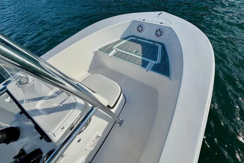 Slide: The Image of 2024 Tidewater 180 CC Adventure boat on water, showcasing sleek deck design. - 14