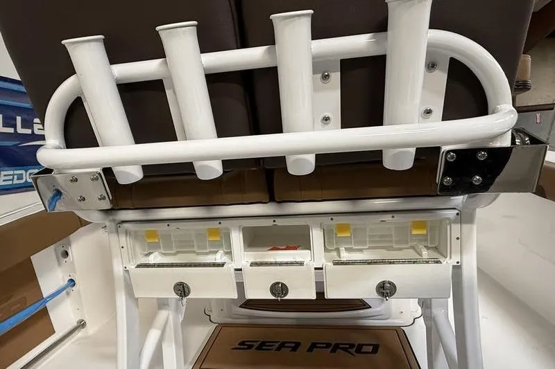 Slide: The Image of 2026 Sea Pro 242 Center Console boat with rod holders and storage compartments. - 14