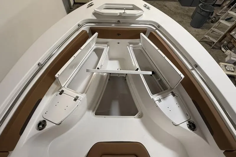Slide: The Image of 2026 Sea Pro 242 Center Console boat with open storage compartments and sleek design. - 19