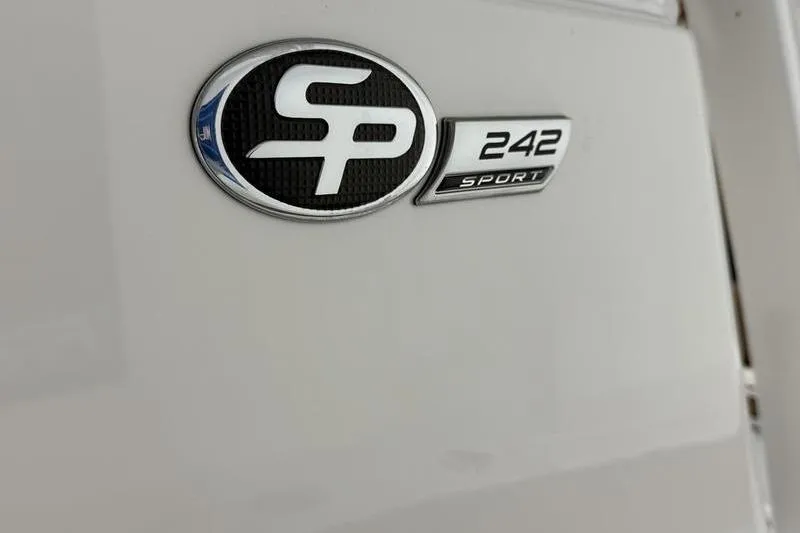 Slide: The Image of 2026 Sea Pro 242 Center Console emblem on white surface. - 21