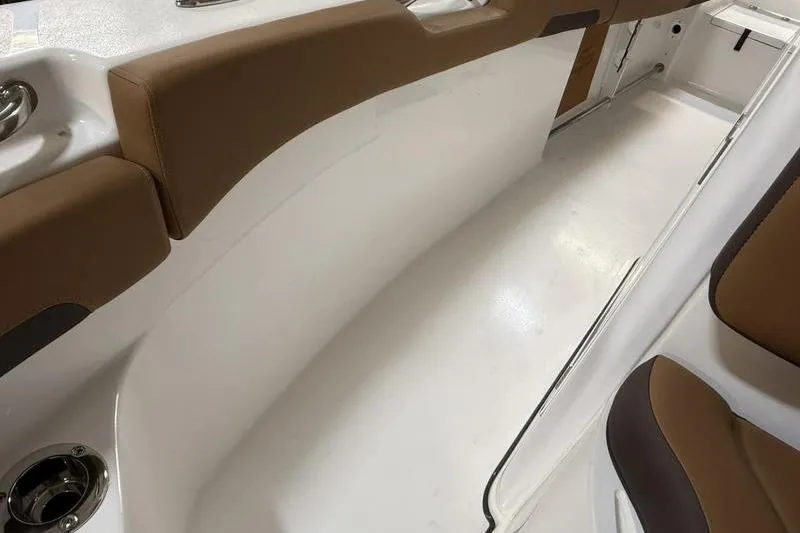 Slide: The Image of 2026 Sea Pro 242 Center Console interior with brown seating and white deck. - 22