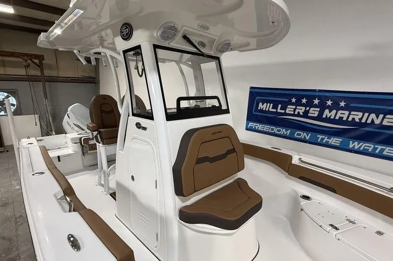 Slide: The Image of 2026 Sea Pro 242 Center Console boat with brown seating, showcased at Miller's Marine. - 23