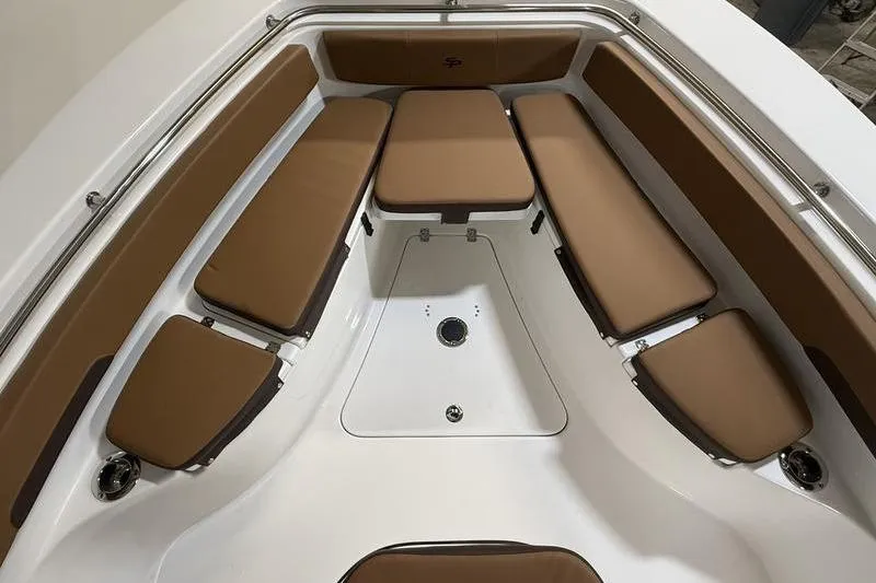 Slide: The Image of 2026 Sea Pro 242 Center Console boat interior with brown cushioned seating. - 28