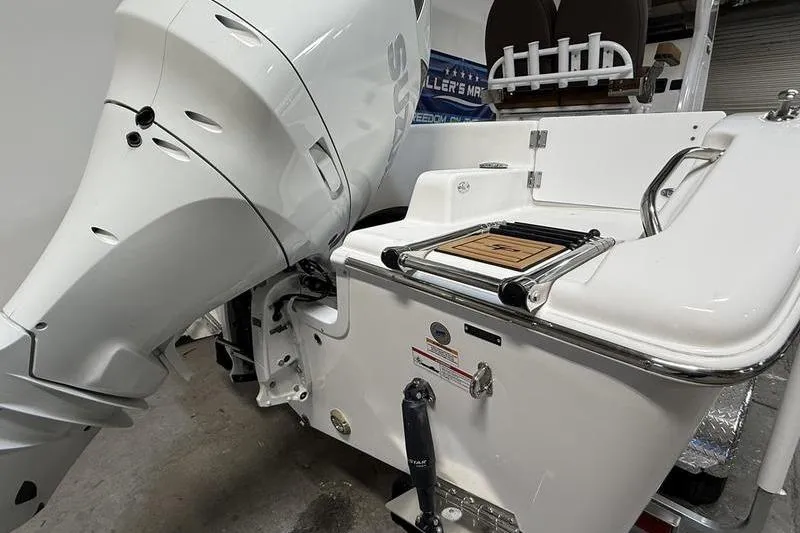 Slide: The Image of 2026 Sea Pro 242 Center Console boat with powerful outboard motor and swim platform. - 4