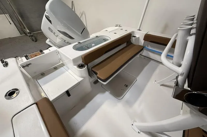Slide: The Image of 2026 Sea Pro 242 Center Console boat interior with seating and storage compartments. - 6