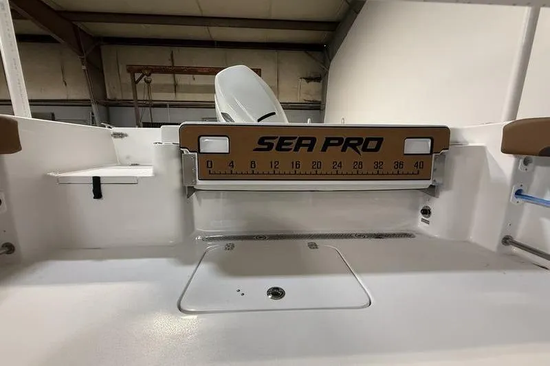 Slide: The Image of 2026 Sea Pro 242 Center Console boat interior with measuring board. - 9