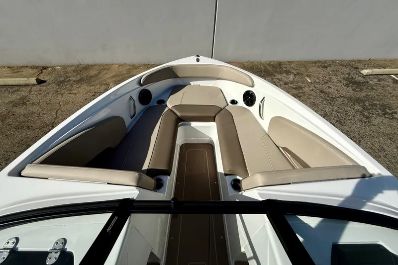 Slide: The Image of 2026 Tahoe 210 S boat interior with beige seating and modern design. - 22