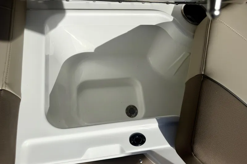 Slide: The Image of Interior view of 2026 Tahoe 210 S boat seating area with storage compartment. - 37