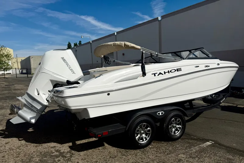 Slide: The Image of 2026 Tahoe 210 S boat on trailer, featuring Mercury outboard motor. - 9