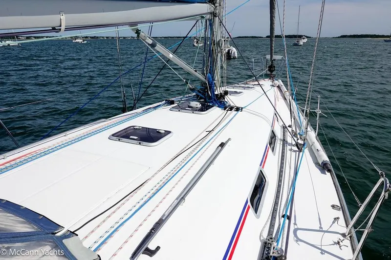 Slide: The Image of 2005 Beneteau First 44.7 sailboat deck view on calm waters. - 16
