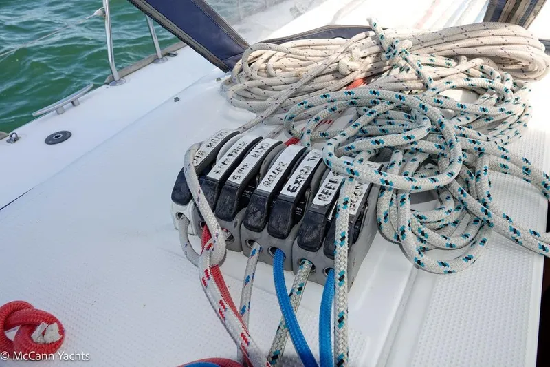 Slide: The Image of Rope clutches and lines on a 2005 Beneteau First 44.7 sailboat deck. - 17