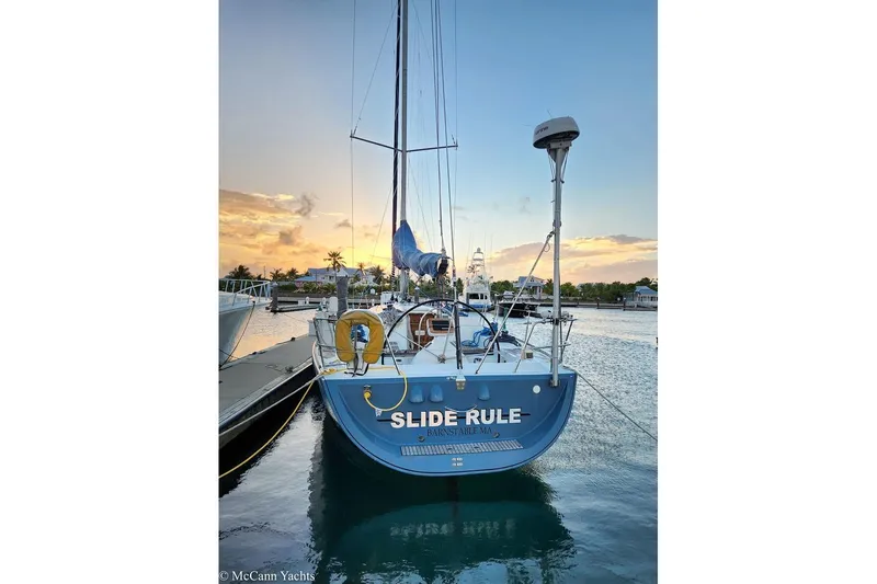 Slide: The Image of Beneteau First 44.7 sailboat docked at sunset, 2005 model. - 2