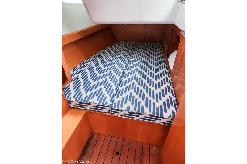 Slide: The Image of Cozy cabin bed with patterned mattress on 2005 Beneteau First 44.7 yacht. - 27