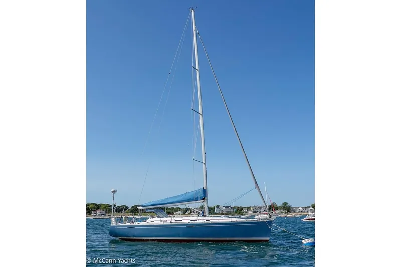 Slide: The Image of 2005 Beneteau First 44.7 sailboat on water under clear blue sky. - 4