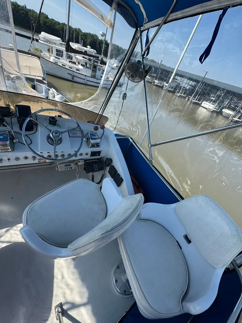 Slide: The Image of Interior of 1968 Hatteras 31 Flybridge at marina. - 13