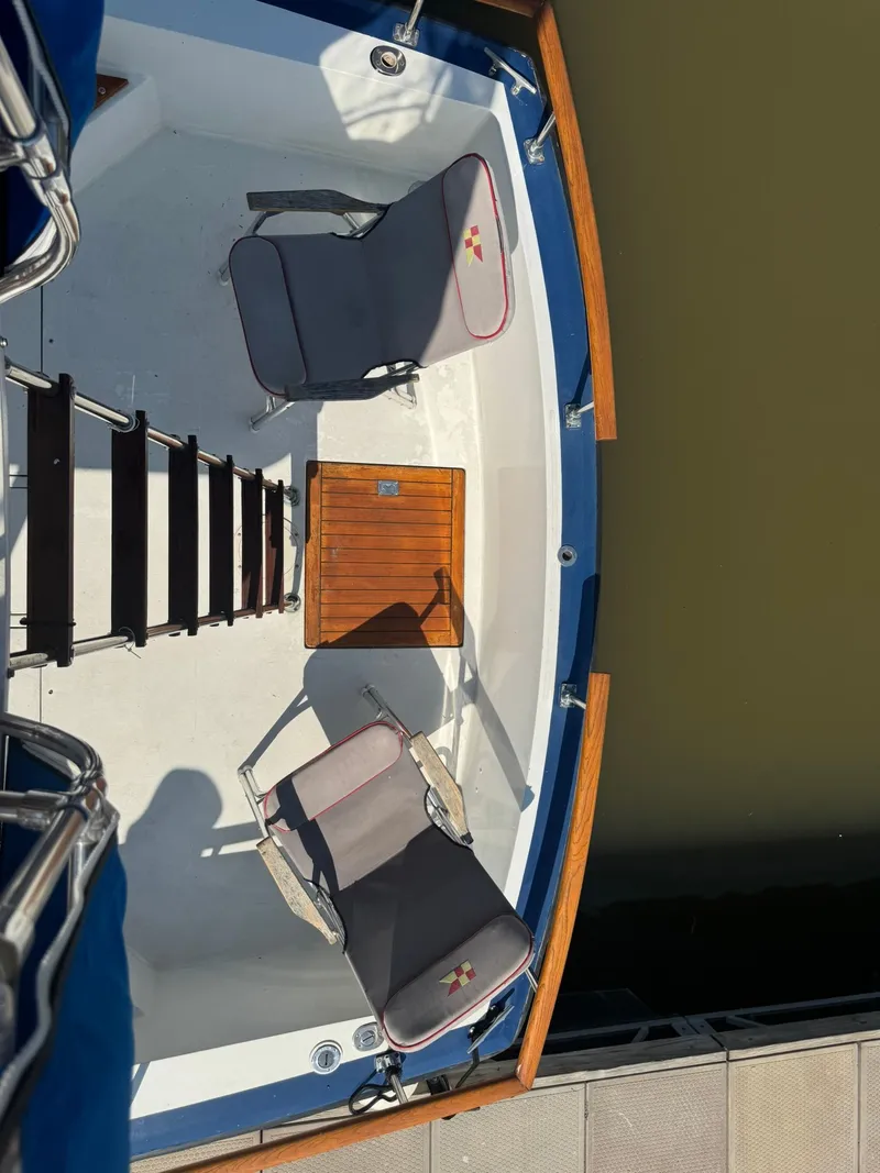 Slide: The Image of Top view of 1968 Hatteras 31 Flybridge with two chairs. - 14