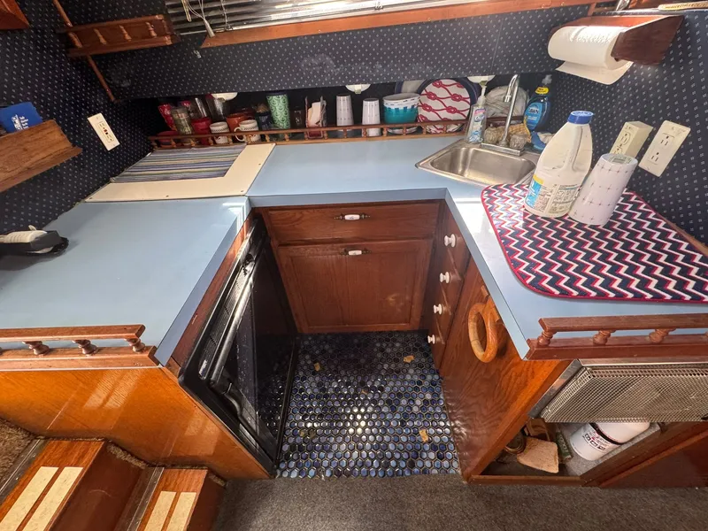 Slide: The Image of Interior of 1968 Hatteras 31 Flybridge with kitchen and sink. - 17