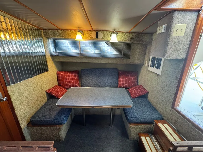 Slide: The Image of Interior of 1968 Hatteras 31 Flybridge with cozy seating area. - 18