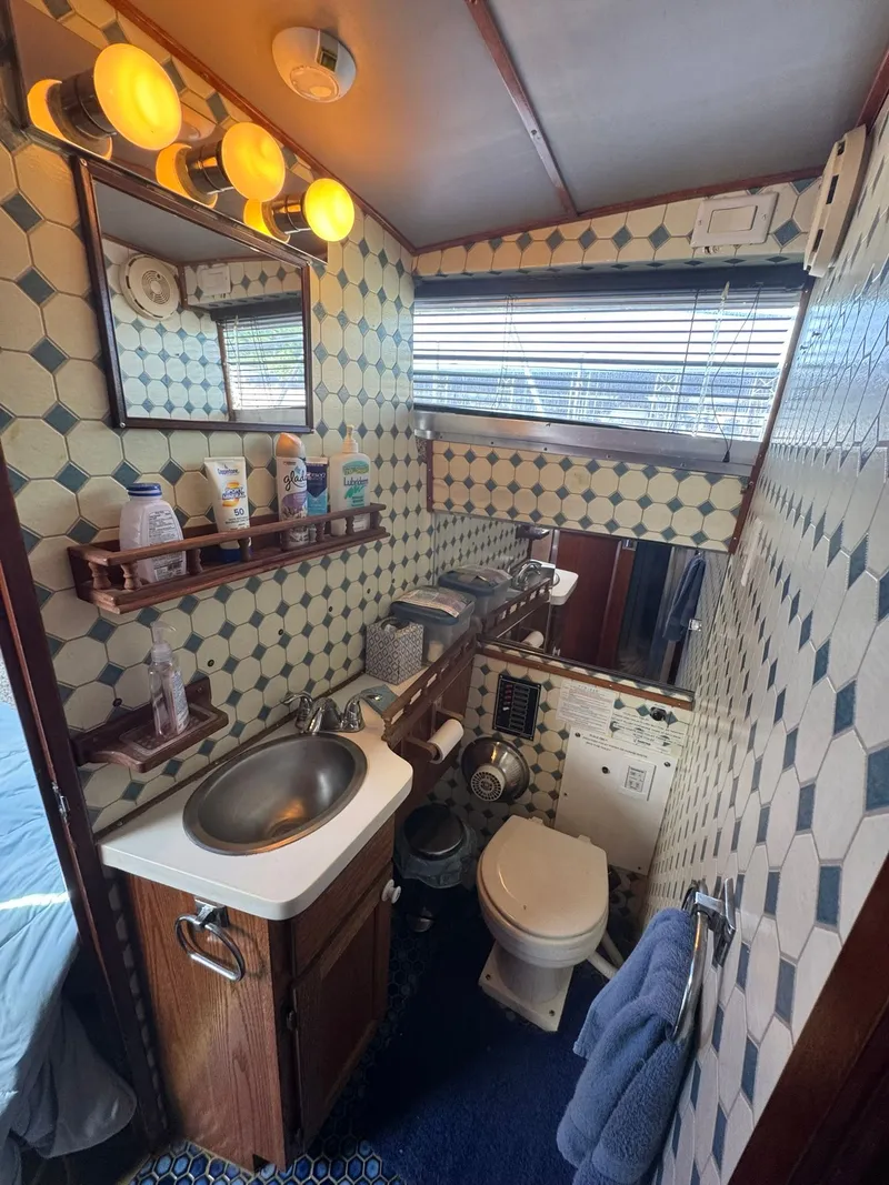 Slide: The Image of Interior view of a 1968 Hatteras 31 Flybridge yacht bathroom. - 20