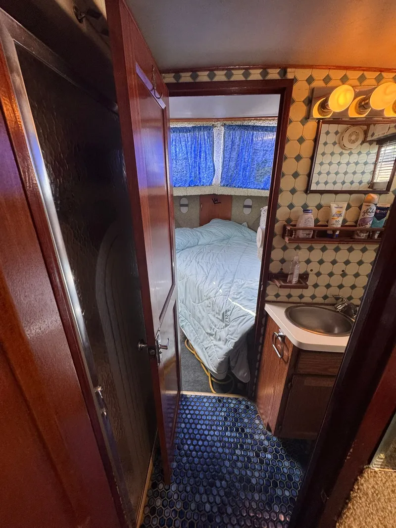 Slide: The Image of Interior of 1968 Hatteras 31 Flybridge with bed and bathroom. - 21
