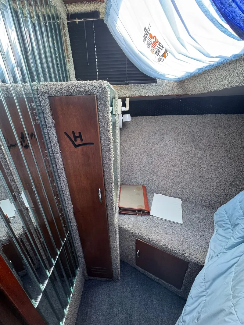 Slide: The Image of Interior of a 1968 Hatteras 31 Flybridge with carpet and wood details. - 23