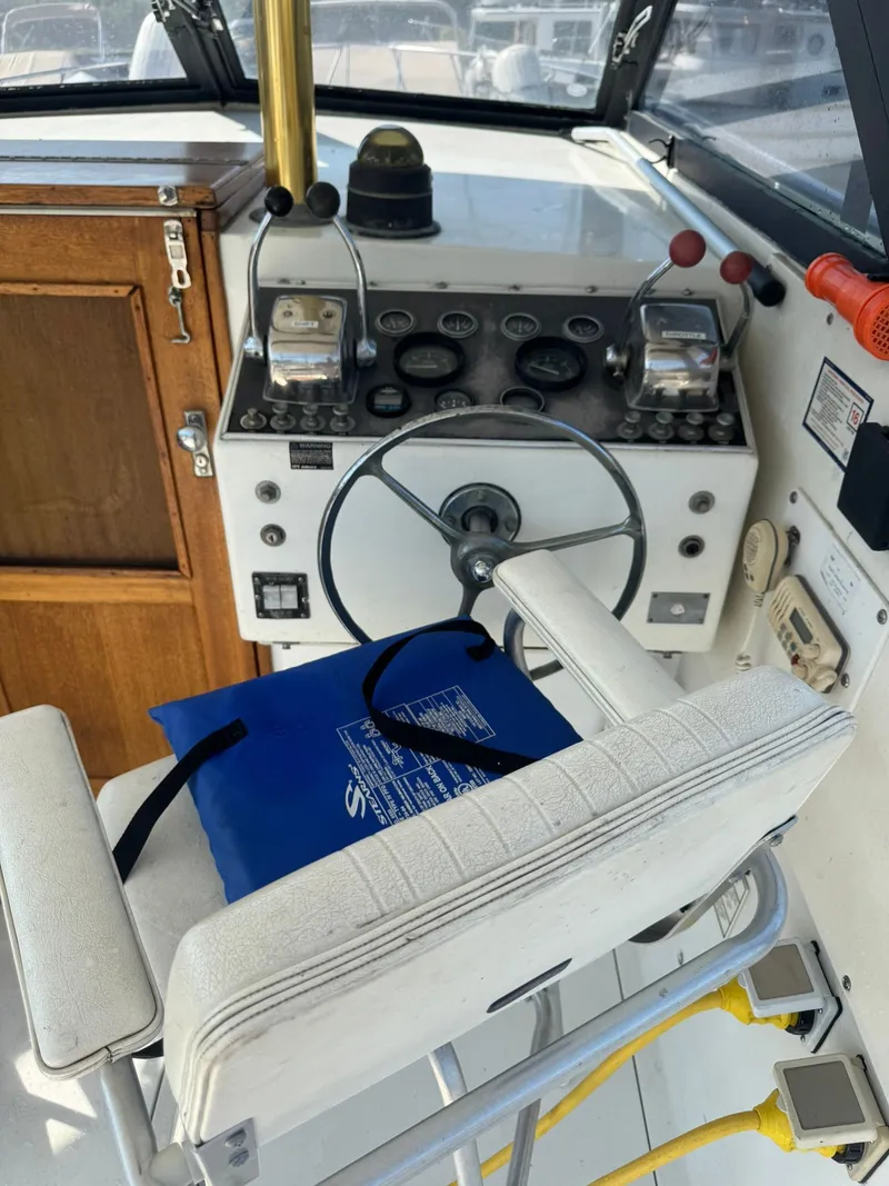 Slide: The Image of 1968 Hatteras 31 Flybridge helm with instruments. - 6