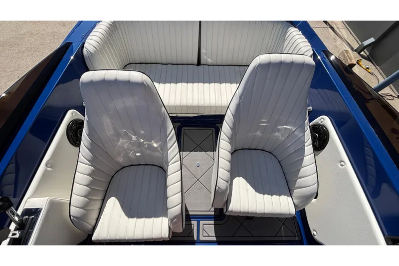Slide: The Image of 2026 Donzi 22 Classic boat interior with white seating and blue accents. - 10
