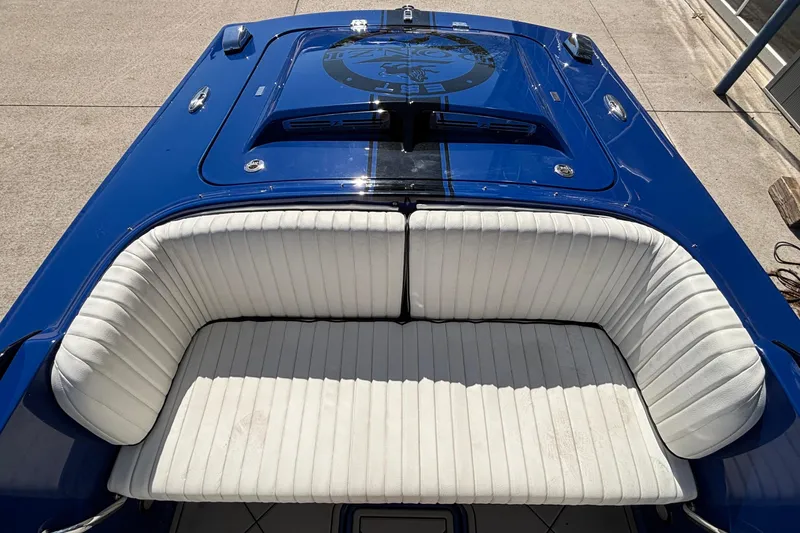 Slide: The Image of 2026 Donzi 22 Classic boat with blue exterior and white seating. - 12