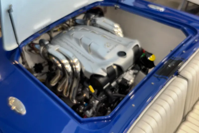 Slide: The Image of Engine compartment of a 2026 Donzi 22 Classic boat, showcasing a powerful engine. - 14