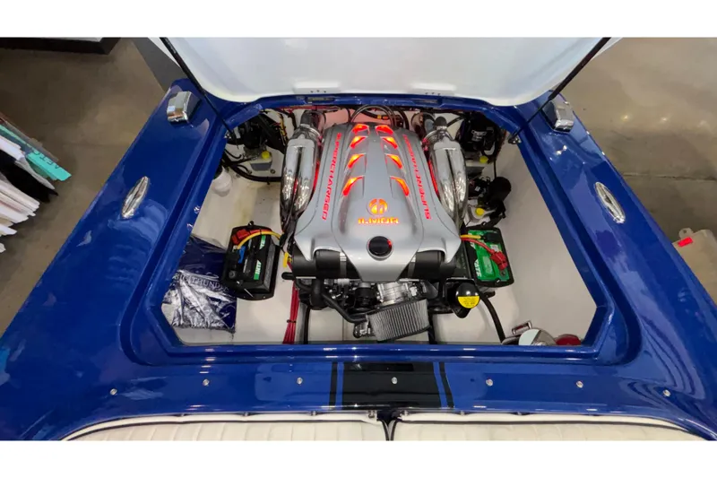 Slide: The Image of Engine compartment of a 2026 Donzi 22 Classic boat, featuring a powerful supercharged engine. - 16