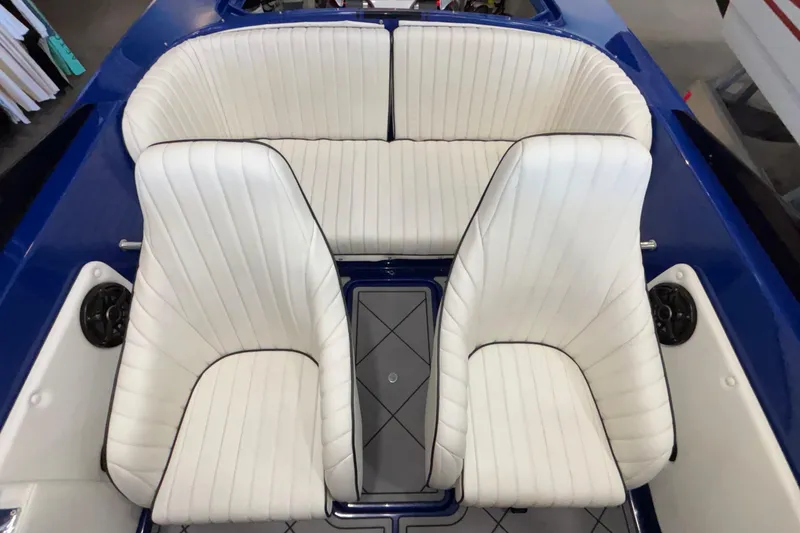 Slide: The Image of 2026 Donzi 22 Classic boat interior with white leather seats and blue accents. - 18