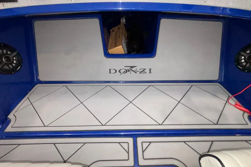 Slide: The Image of 2026 Donzi 22 Classic boat interior with blue accents and logo. - 29