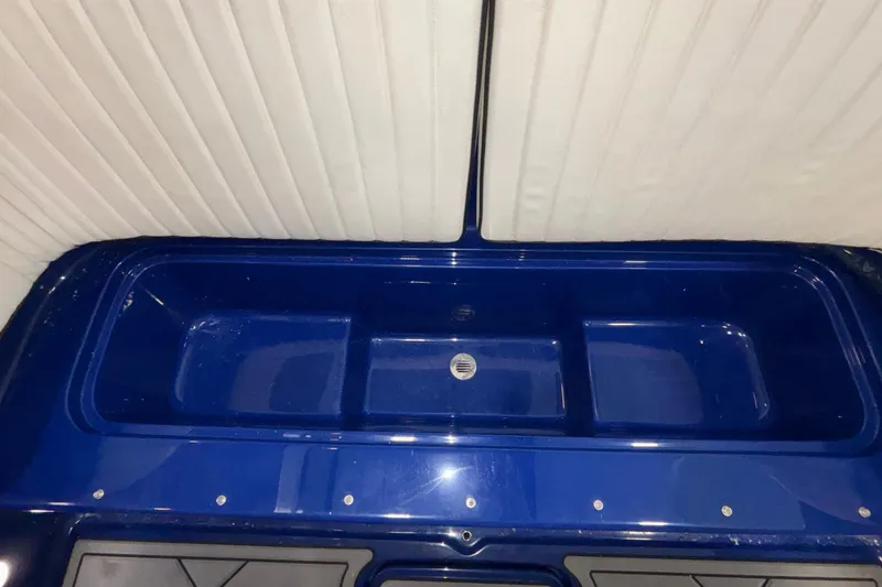 Slide: The Image of Interior view of a 2026 Donzi 22 Classic boat with blue detailing. - 33