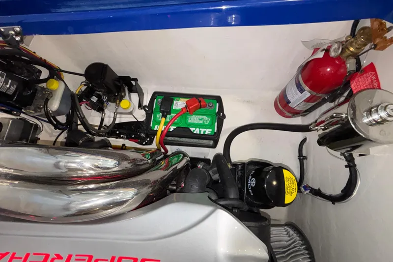 Slide: The Image of Engine compartment of a 2026 Donzi 22 Classic with battery and fire extinguisher. - 36