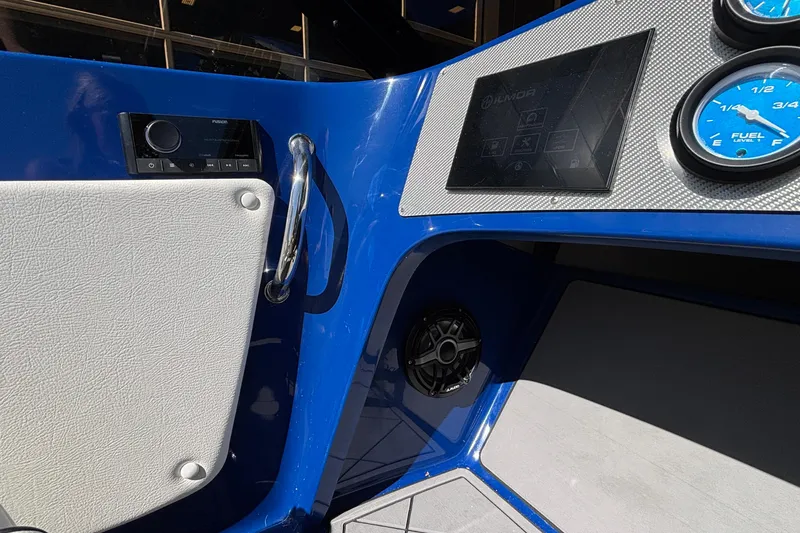 Slide: The Image of Interior dashboard of 2026 Donzi 22 Classic boat with modern controls and gauges. - 9