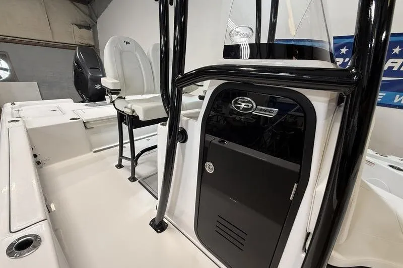 Slide: The Image of 2026 Sea Pro 250 Bay boat interior with seating and console details. - 11