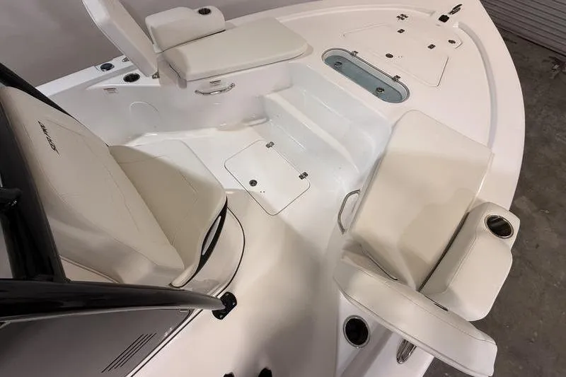 Slide: The Image of 2026 Sea Pro 250 Bay boat interior with seating and storage compartments. - 18