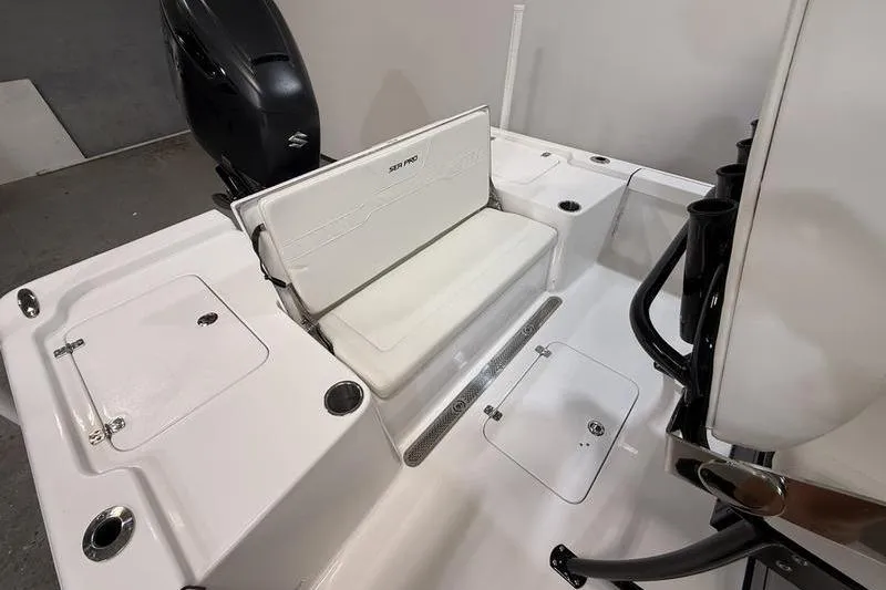 Slide: The Image of 2026 Sea Pro 250 Bay boat interior with seating and storage compartments. - 7