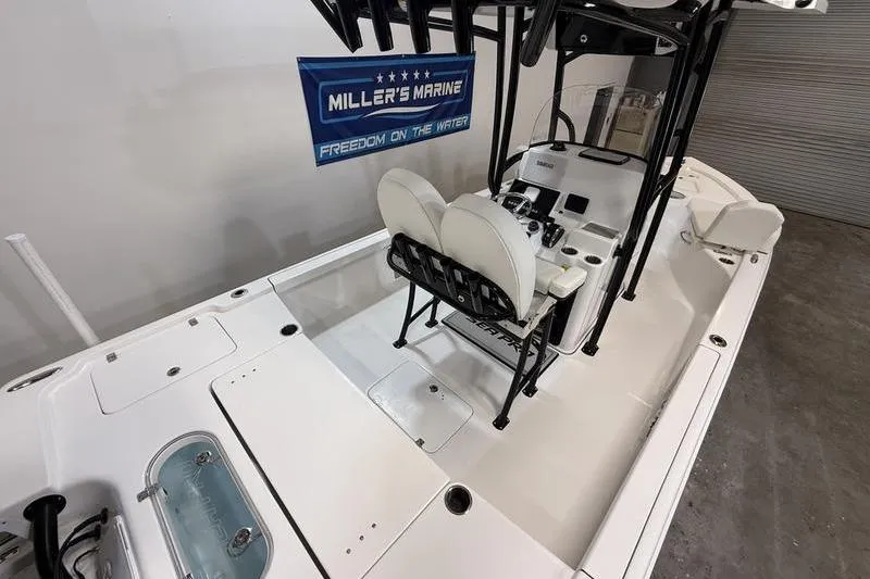 Slide: The Image of 2026 Sea Pro 250 Bay boat interior with dual seats and control console. - 9