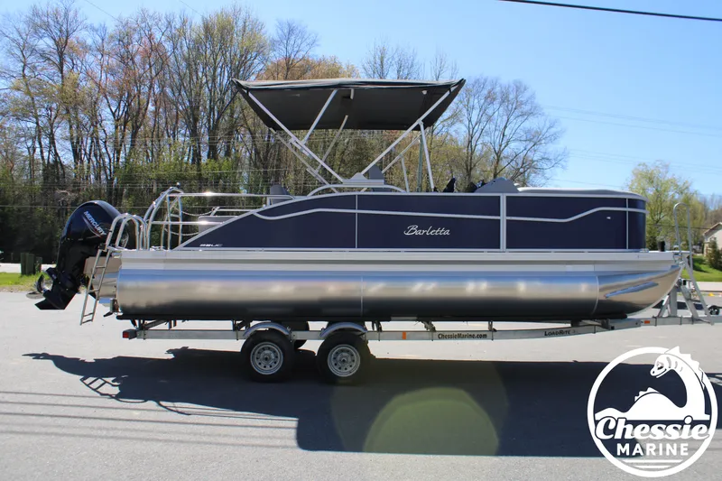 Slide: The Image of 2026 Barletta ARIA 22UC pontoon boat on trailer outdoors. - 6