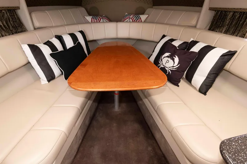 Slide: The Image of Interior of 2004 Formula 330 Sun Sport with beige seating and decorative pillows. - 17