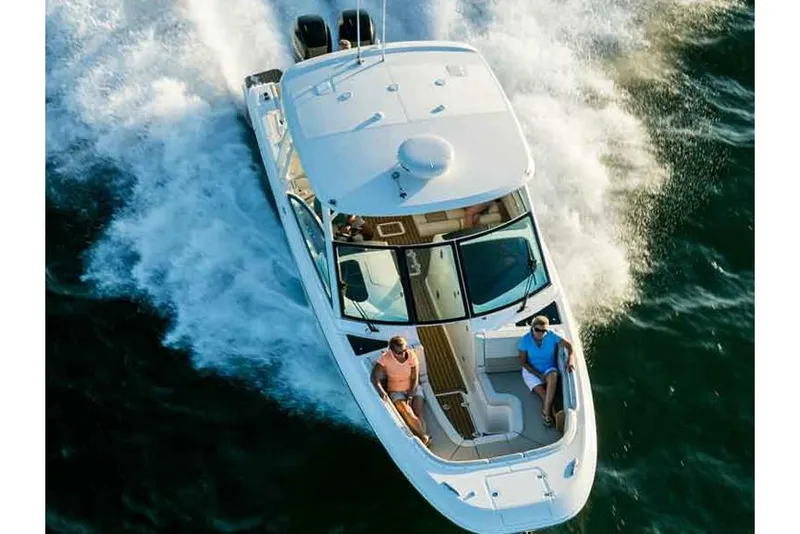 Slide: The Image of Manufacturer Provided Image: 2022 Boston Whaler 320 Vantage cruising on water, aerial view. - 10